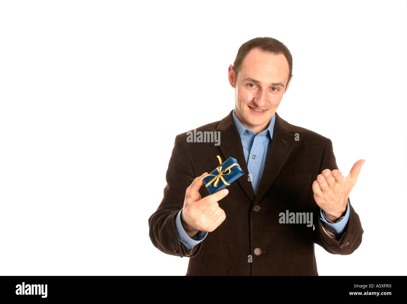 Man standing with gift box smiling close up portrait Stock Photo