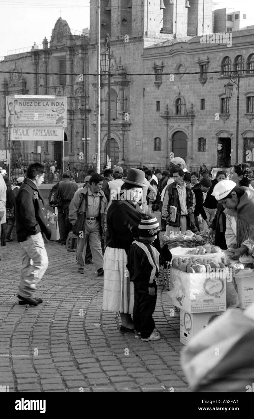 Woman and child buying bread rolls in La Paz Bolivia Stock Photo