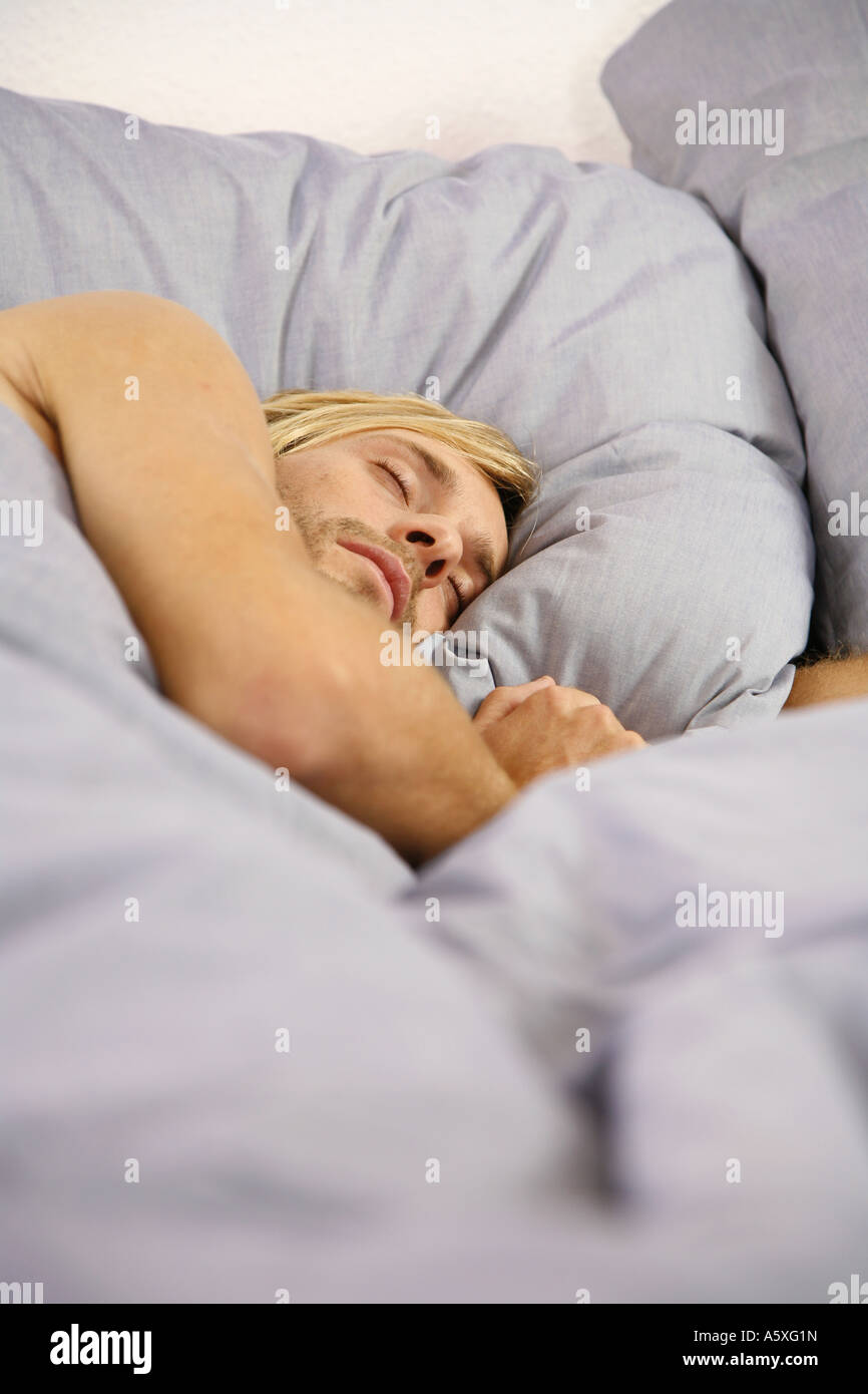 Young man sleeping selective focus Stock Photo