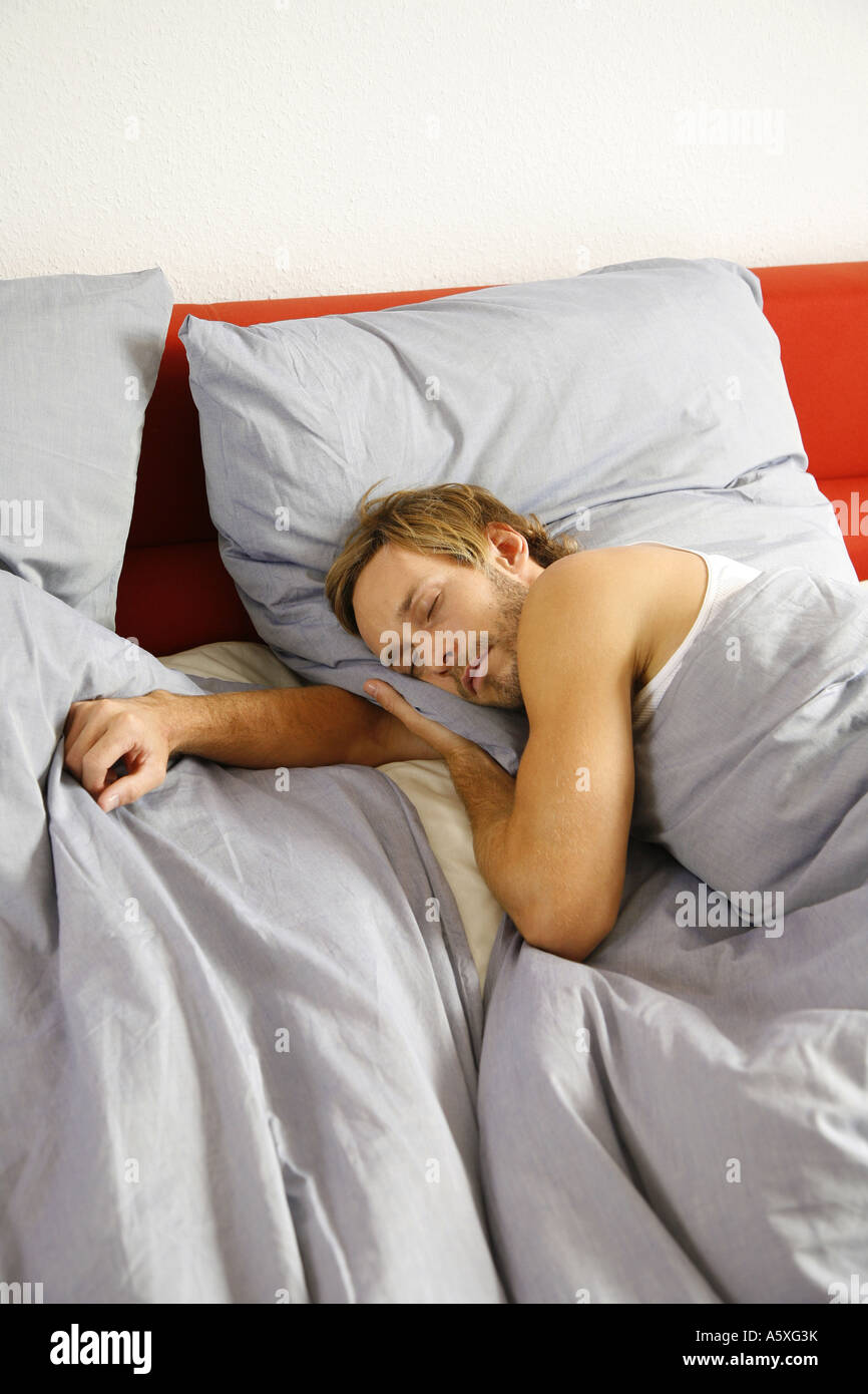 Young man sleeping high angle view Stock Photo