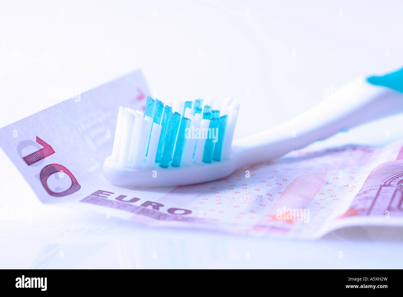 10 Euro banknote and toothbrush close up Stock Photo