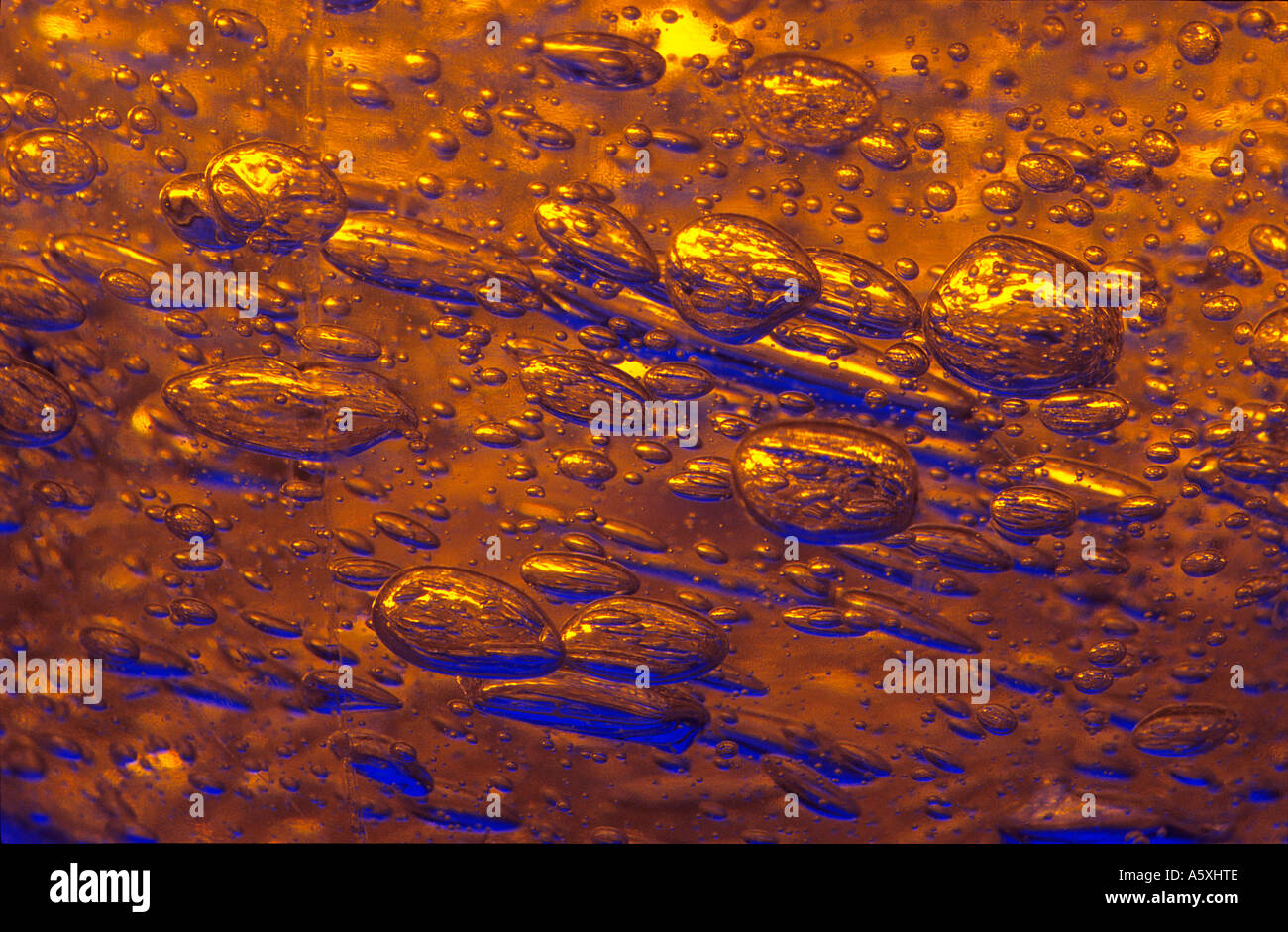 Macrophotography of air bubbles trapped into a gel. Macrophotographie de bulles d'air prises dans un gel. Stock Photo