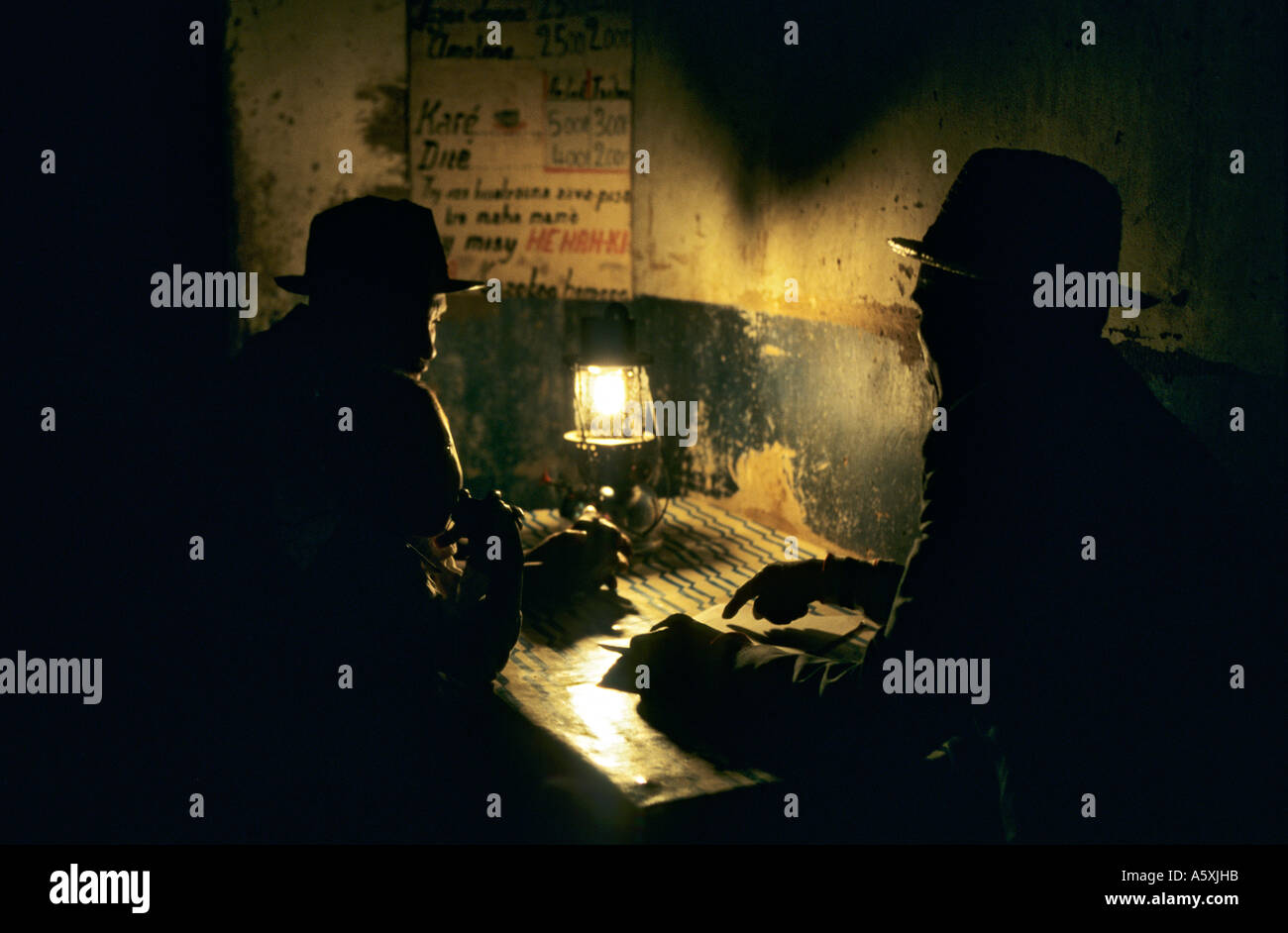 Never-ending discussions in a bar (Ranohira - Madagascar). Palabres dans un bistrot. (Ranohira - Madagascar). Stock Photo