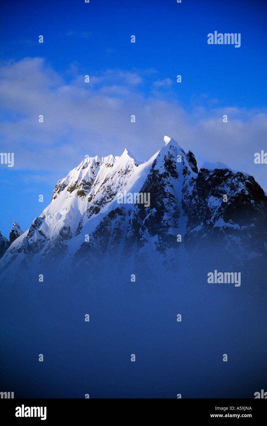 Snow covered Mountain Peak Antarctica Stock Photo
