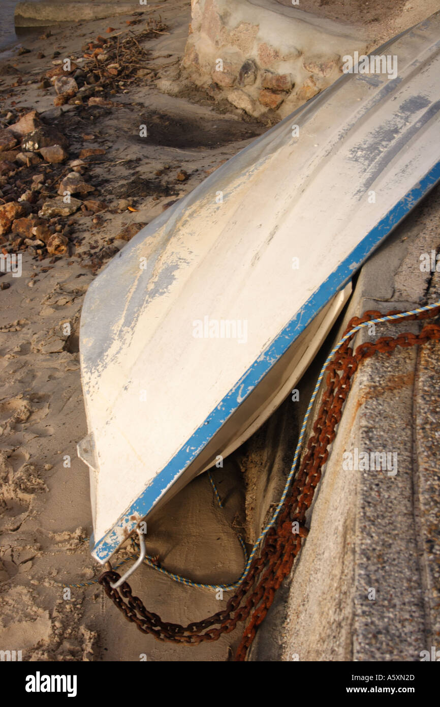 DINGHY TURNED ON ITS SIDE OUT OF THE WATER Stock Photo