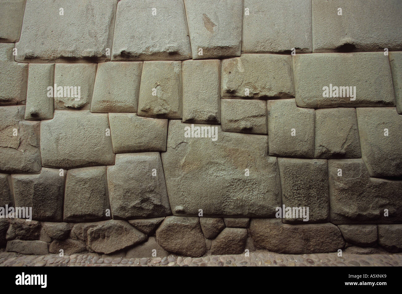 Inca freestone wall with its Twelve Sided Stone (Peru). Mur de pierres inca contenant la fameuse pierre à douze angles (Pérou) Stock Photo