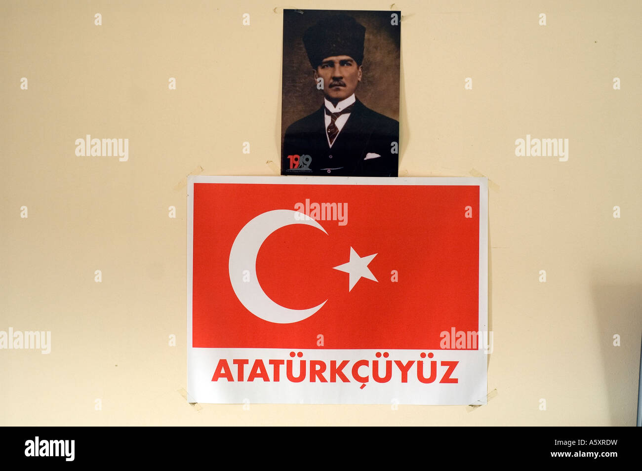 Portrait of Mustafa Kemal Ataturk above a Turkish flag, in a small museum on the Gallipoli peninsula, Turkey. Stock Photo