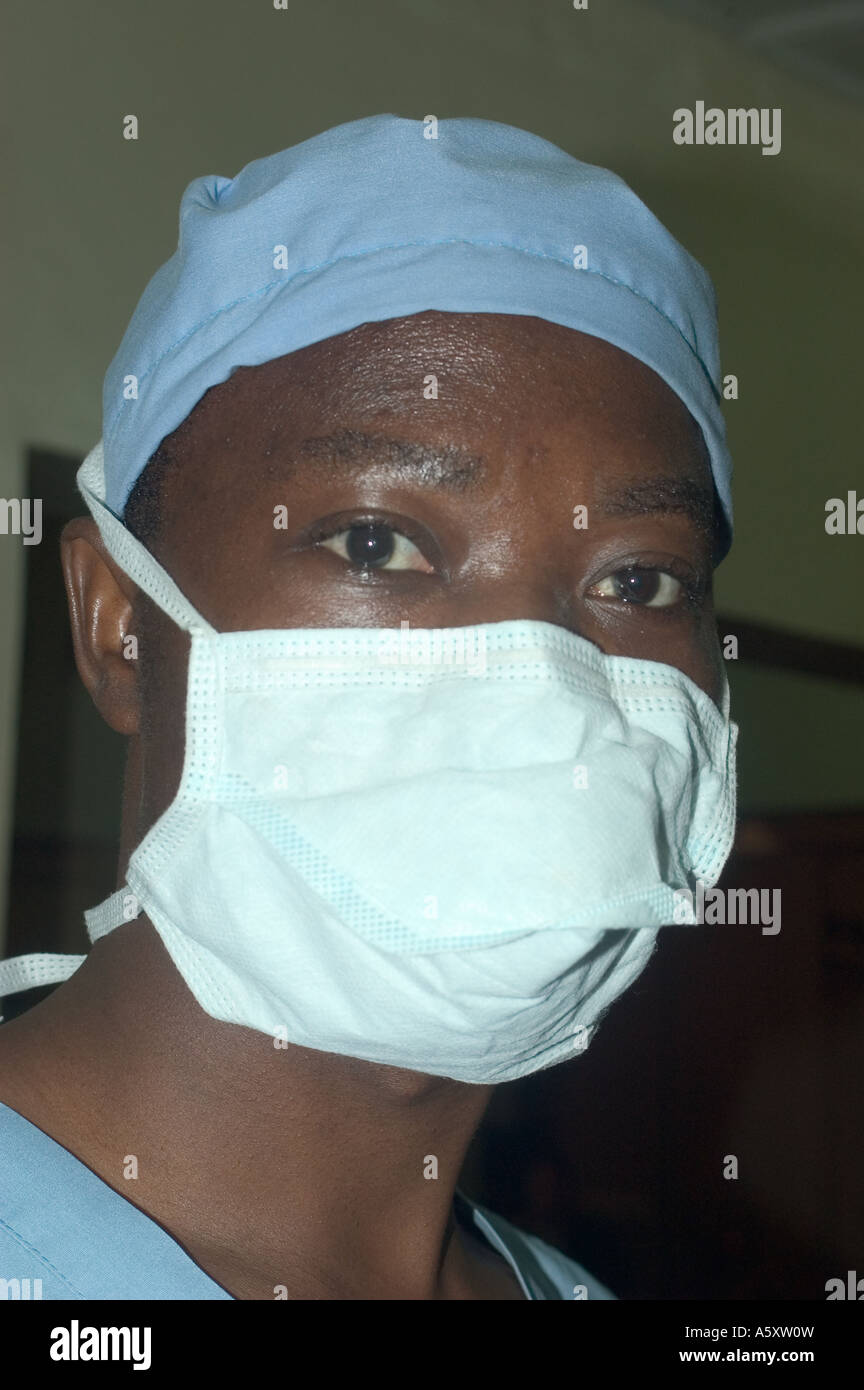 Anesthesiologist in Nigeria wearing face mask cap gloves and gown to prevent the spread of infections during surgery Stock Photo