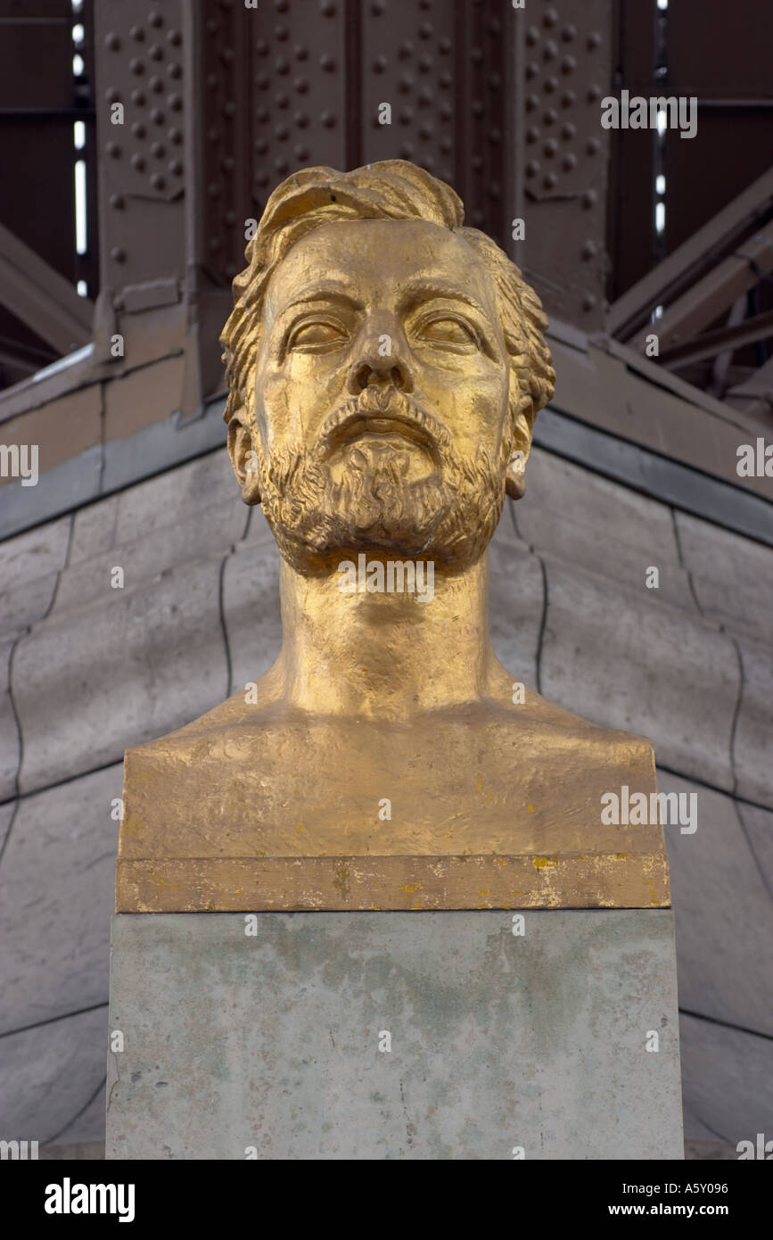 Bust of Gustave Eiffel under the Eiffel Tower Paris France Stock Photo