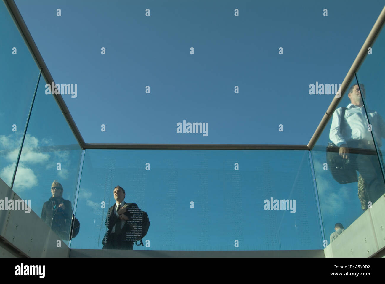 commuters crossing the Thames on the Millennium Bridge London England UK Stock Photo