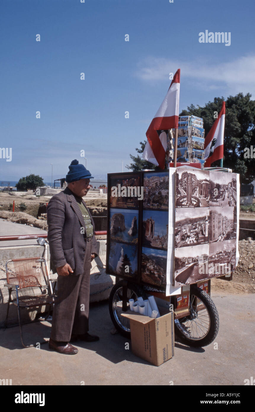 Beirut Old Green Line Man selling posters representing Beirut before the civil war Stock Photo