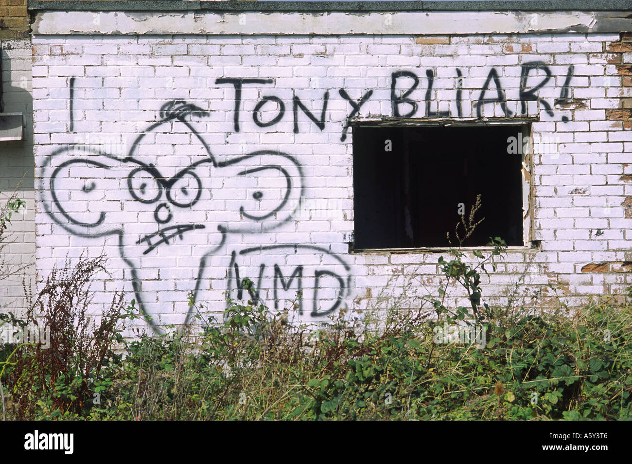 Anti war protest graffiti with caricature of Tony Blair Stock Photo - Alamy