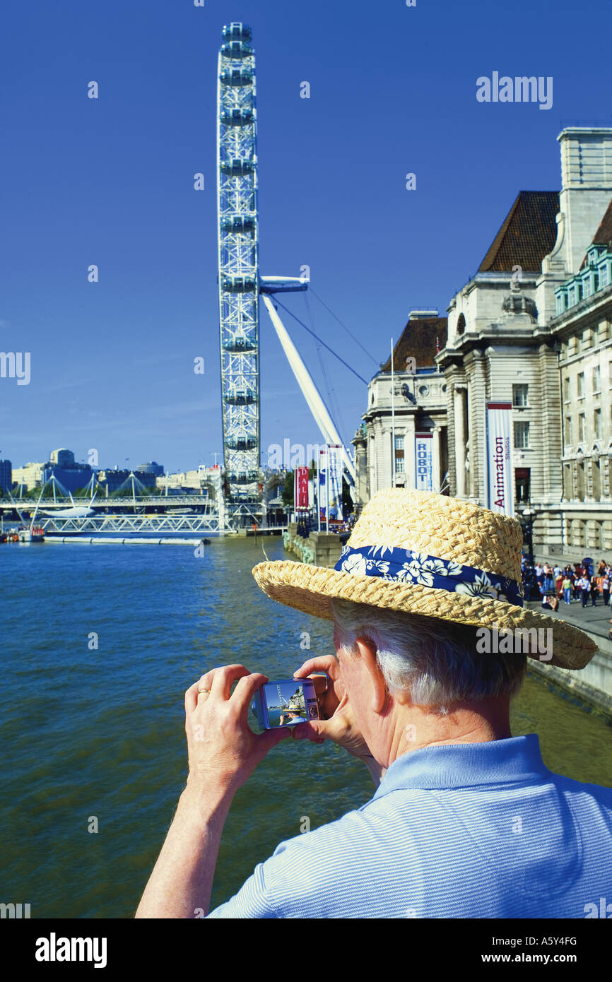 elder tourist and London eye at London United Kingdom Stock Photo