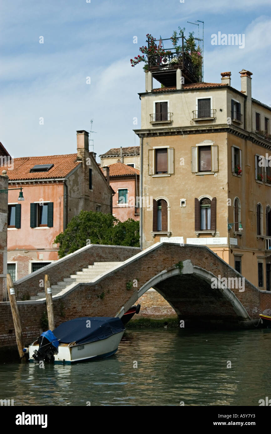 Venice 2005 House with roof garden bridge and motor boat Stock Photo ...