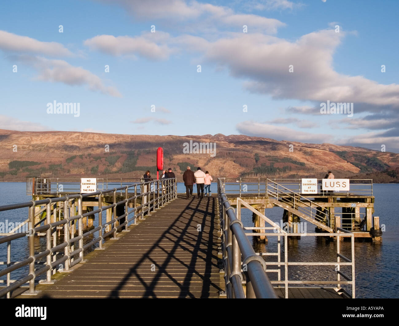 Luss pier and Loch Lomond in evening light in Loch Lomond and the