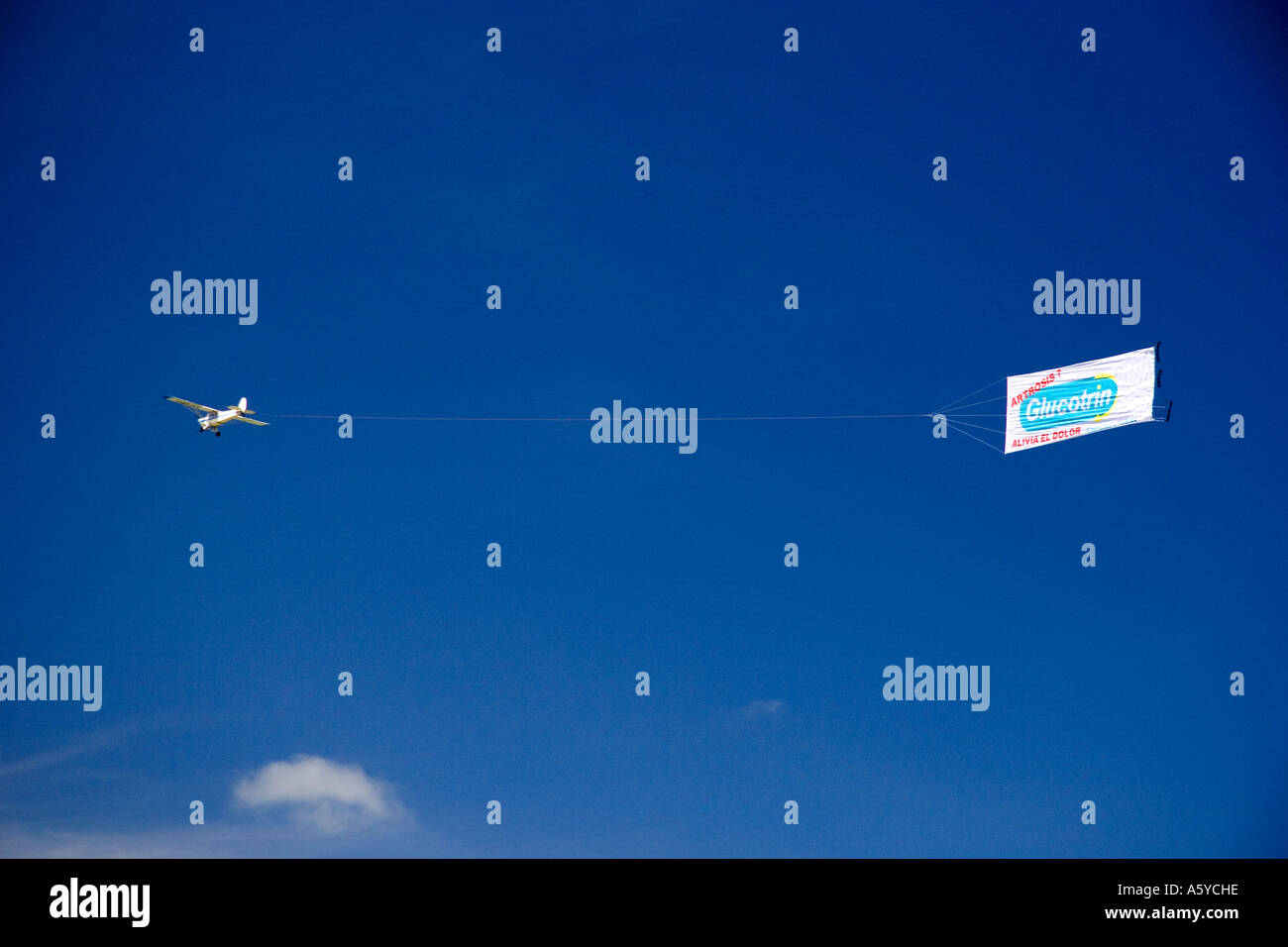Airplane flying with advertisement in Argentina. Stock Photo
