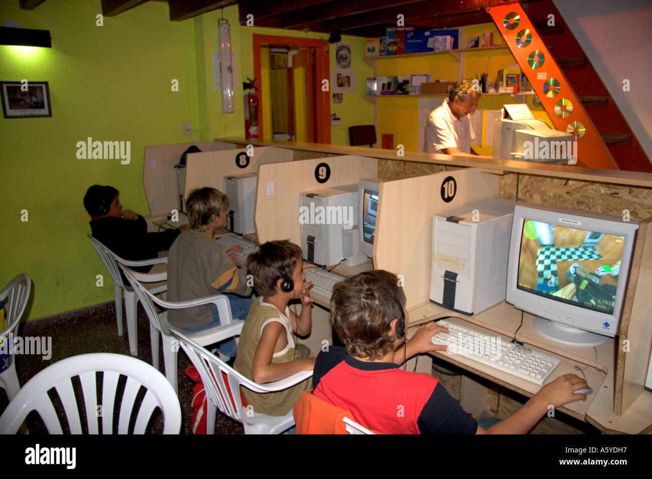 Young boys play computer games at an internet cafe locoturio in Argentina. Stock Photo