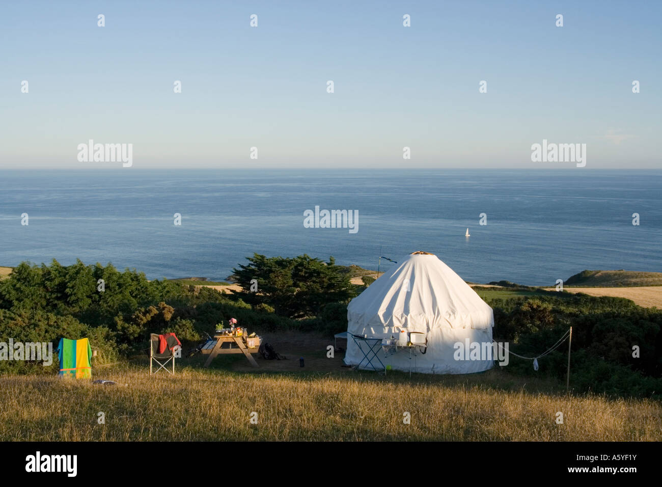 Yurt and camping equipment on field with view of sea, East Prawle, Devon UK Stock Photo Alamy