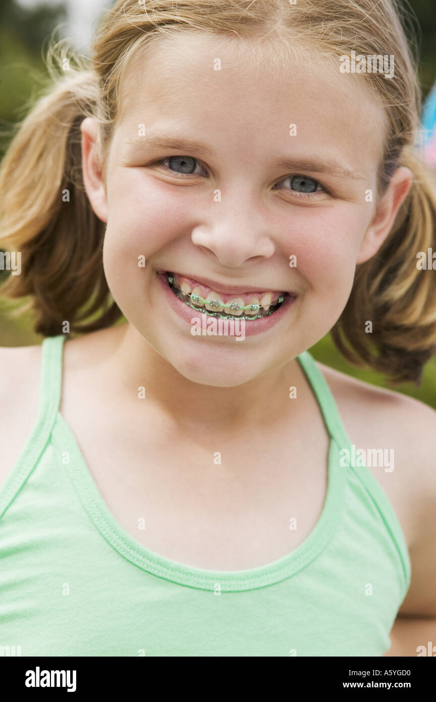 Smiling girl wearing orthodontic braces Stock Photo Alamy