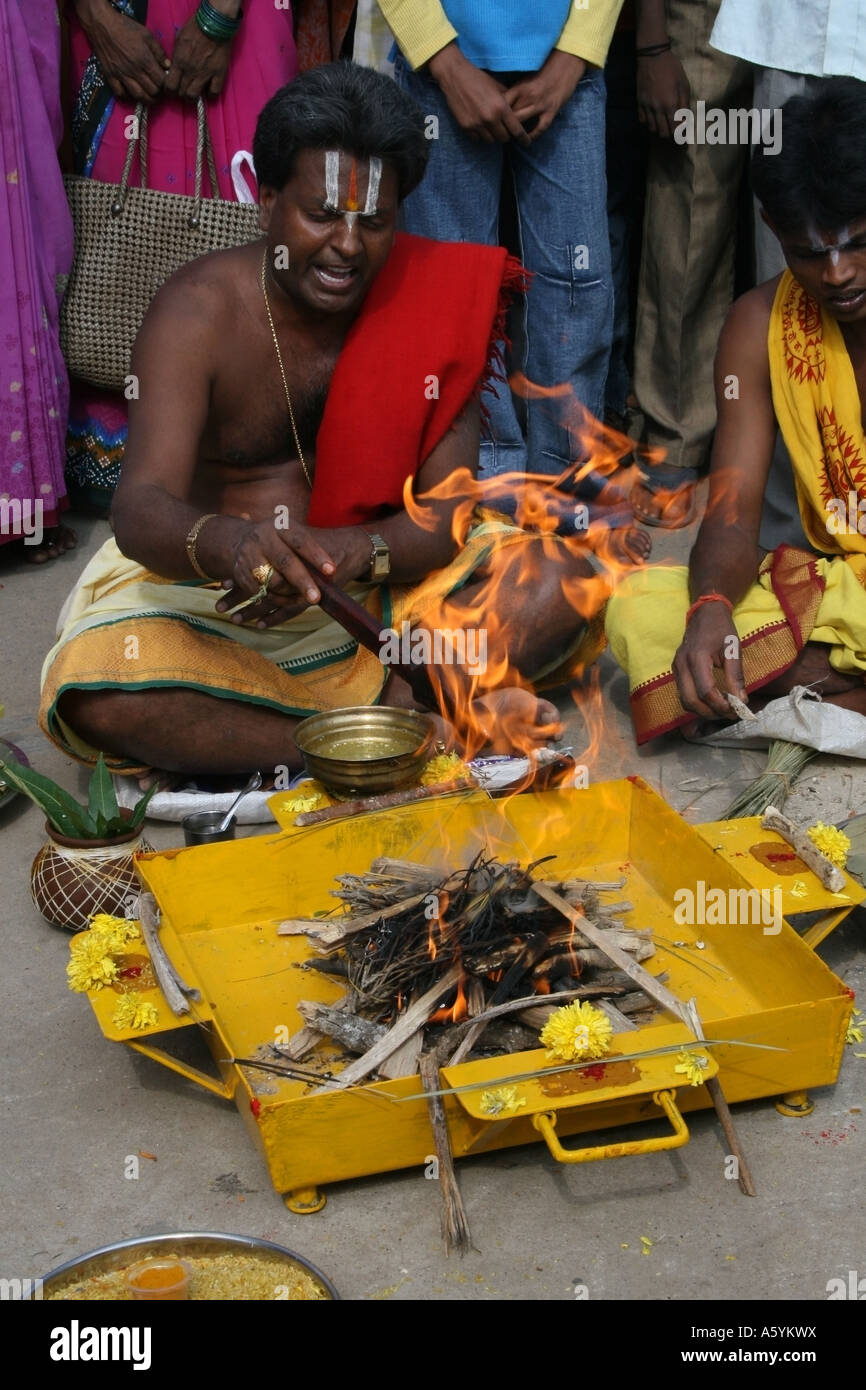 Priest perfoms Havan or arti or fire pooja at the Koti linga temple Kolar, South India for the Hindu festival of Maha shivratri Stock Photo