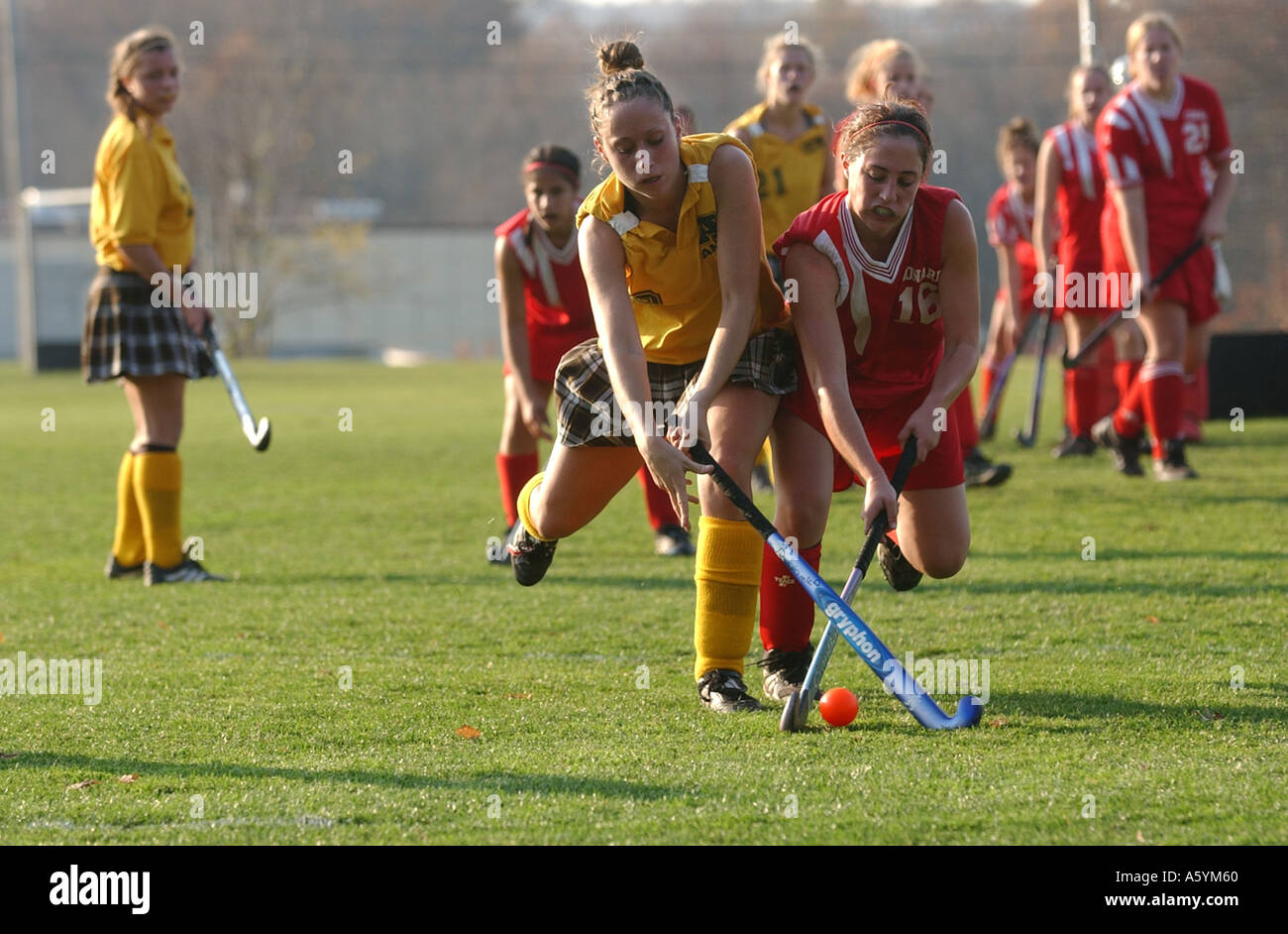Girls Field Hockey players battle for the ball in the midfield Stock Photo