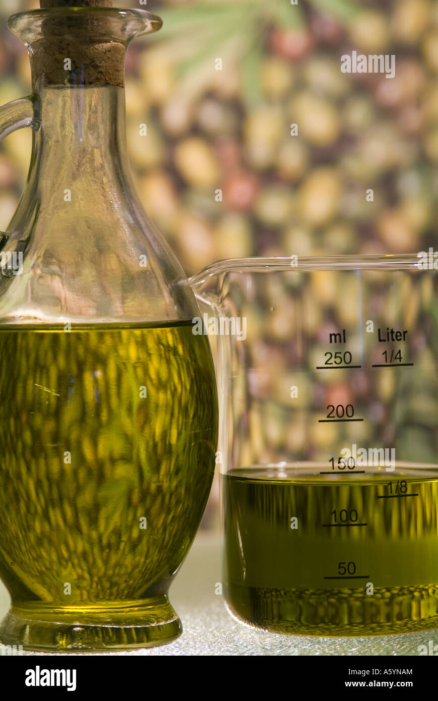bottle oil can and measuring jar glas filled with greece olive oil in