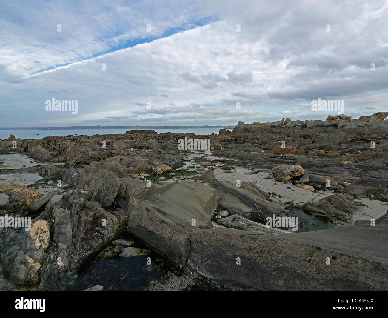 landscape stony strand at the coast in Locquirec in Finistere Brittany ...