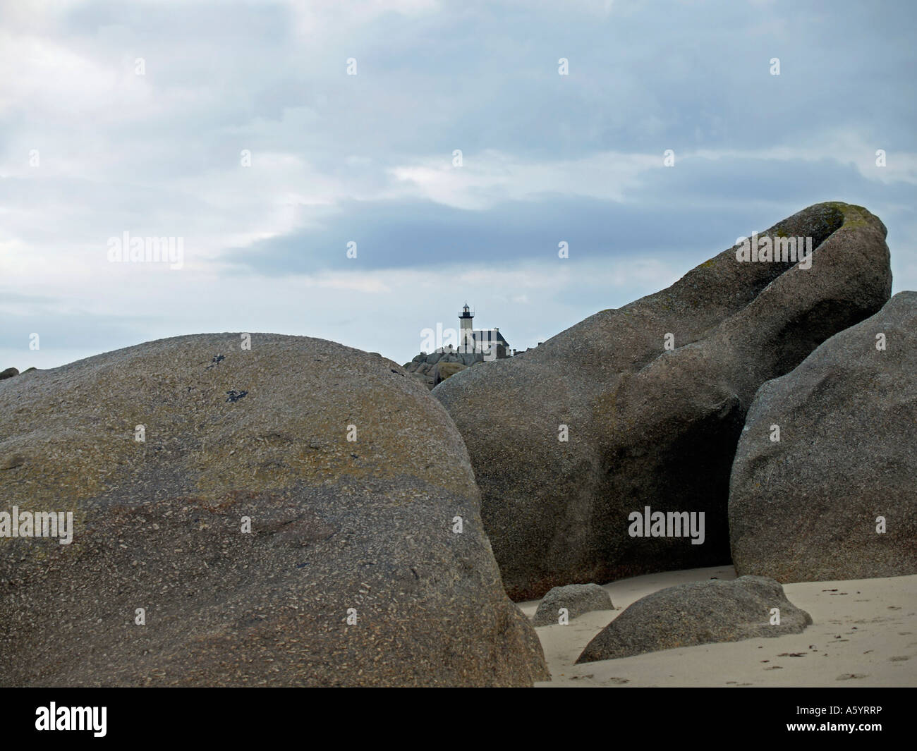 lighthouse light house Pontusval on stony strand with granit rocks at ...