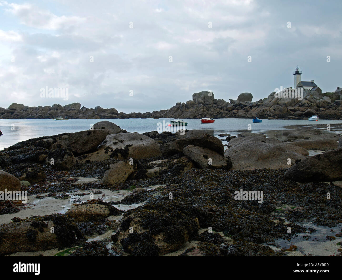 llighthouse light house Pontusval on stony strand with granit rocks at ...