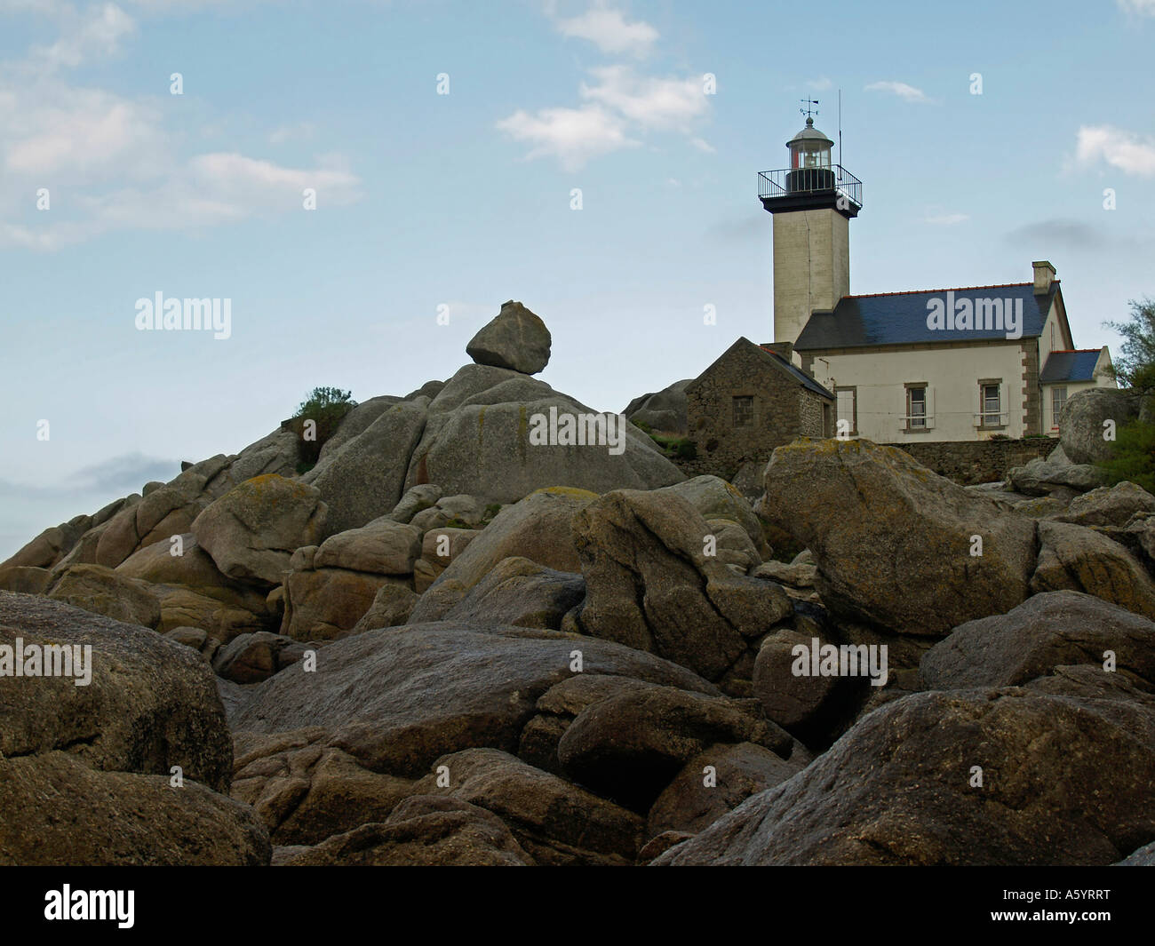 lighthouse light house Pontusval on stony strand with granit rocks at ...