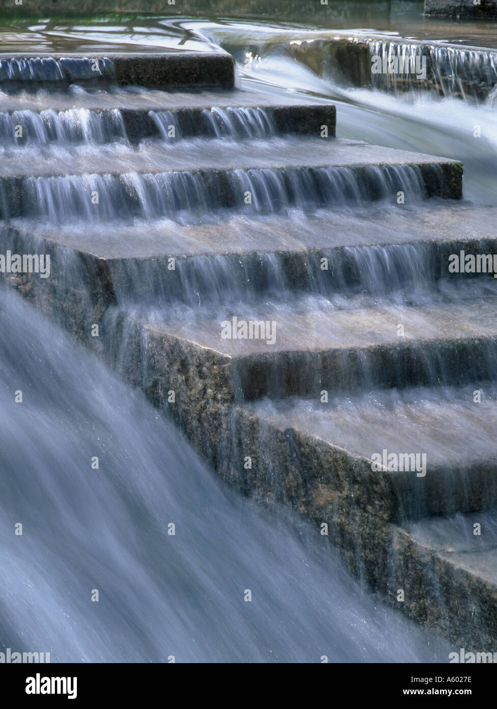 Water flowing over steps of stone Stock Photo