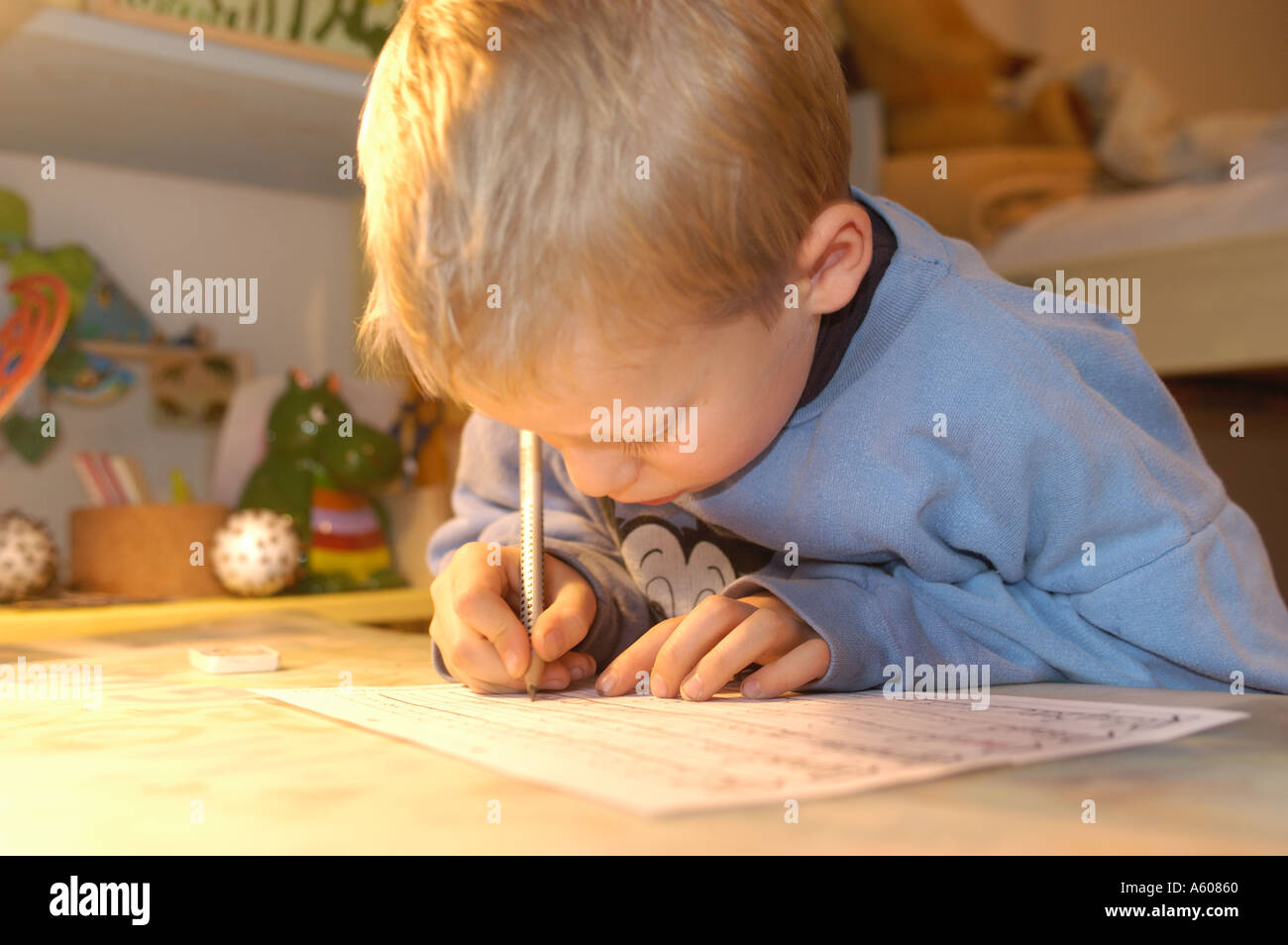Little boy doing his homework Stock Photo