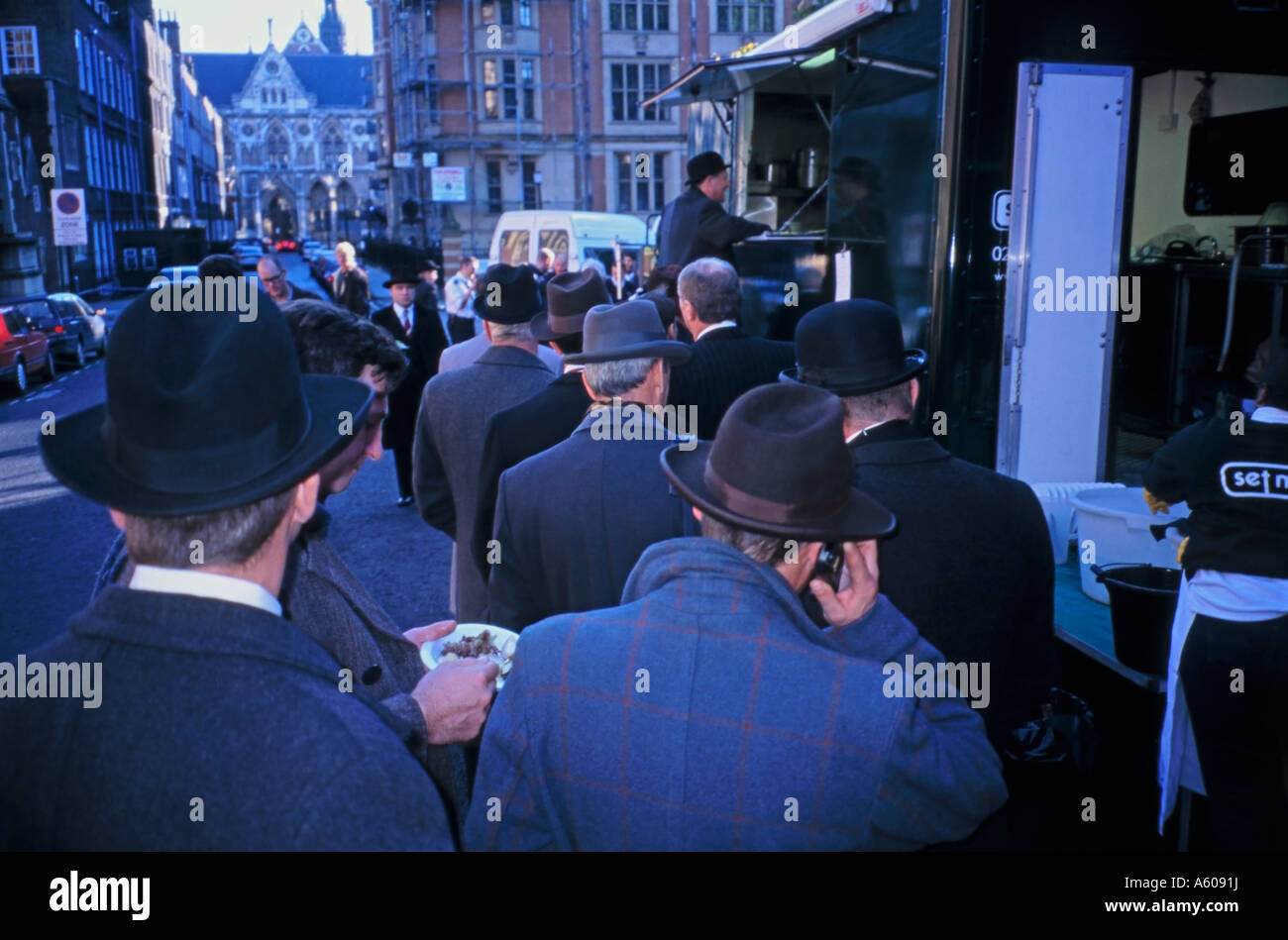 Film and TV Extra's / Supporting artists queuing for lunch Extra Phoning Agent Stock Photo