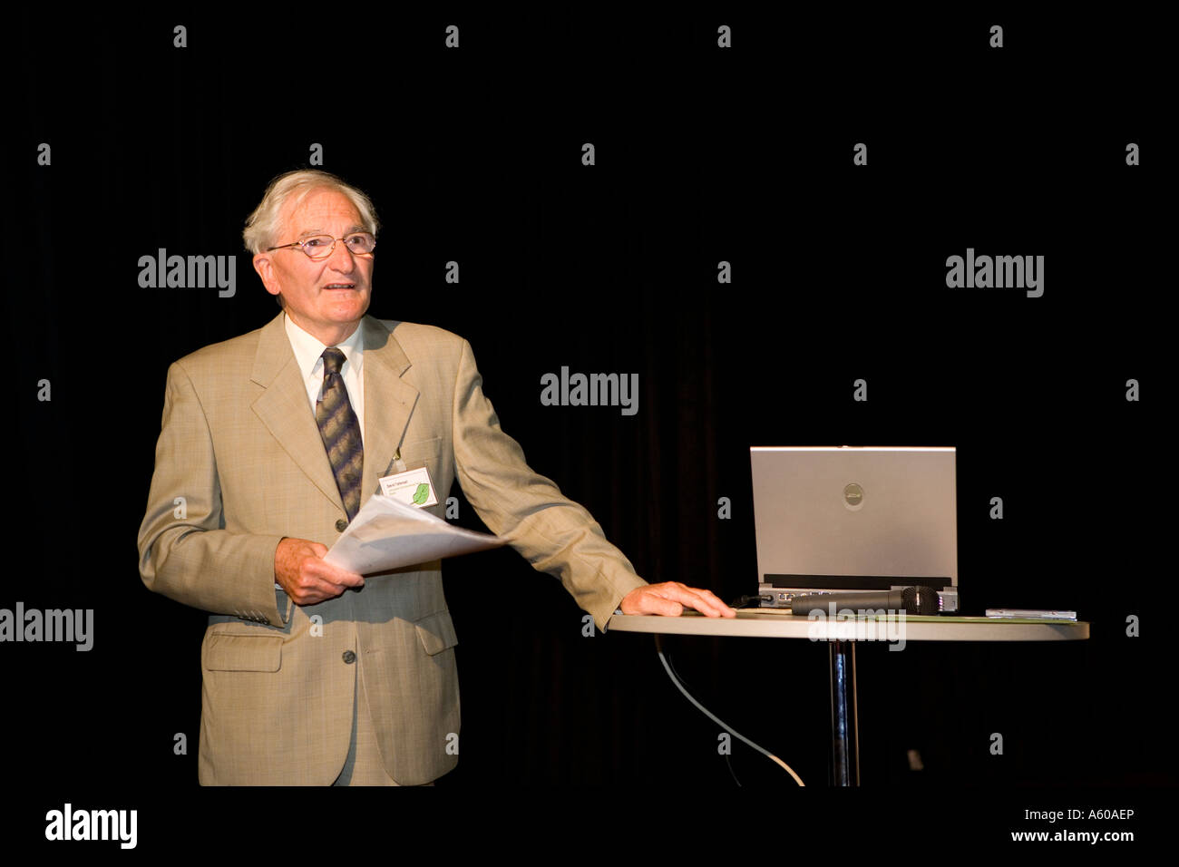 Speaker at a conference with a laptop used for a digital presentation Stock Photo