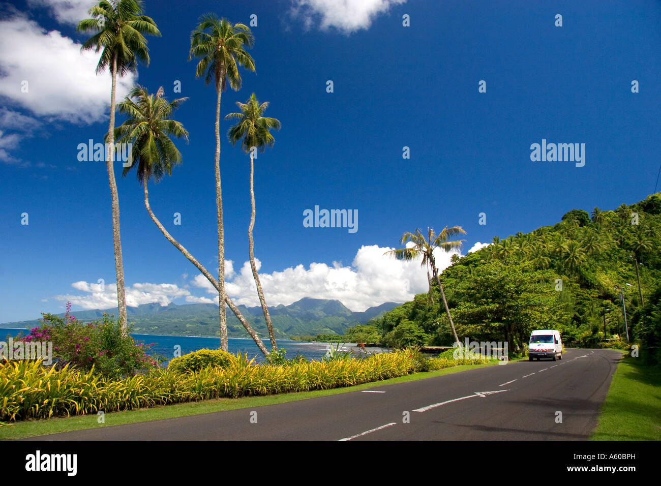 Road and scenic view of the seascape on the island of Tahiti Stock Photo