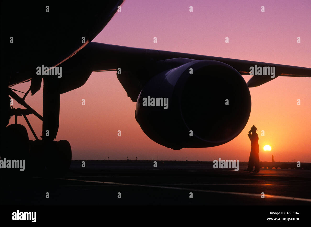 Pilot Inspecting Engine silhouette of airline pilot inspecting engine Stock Photo - Alamy