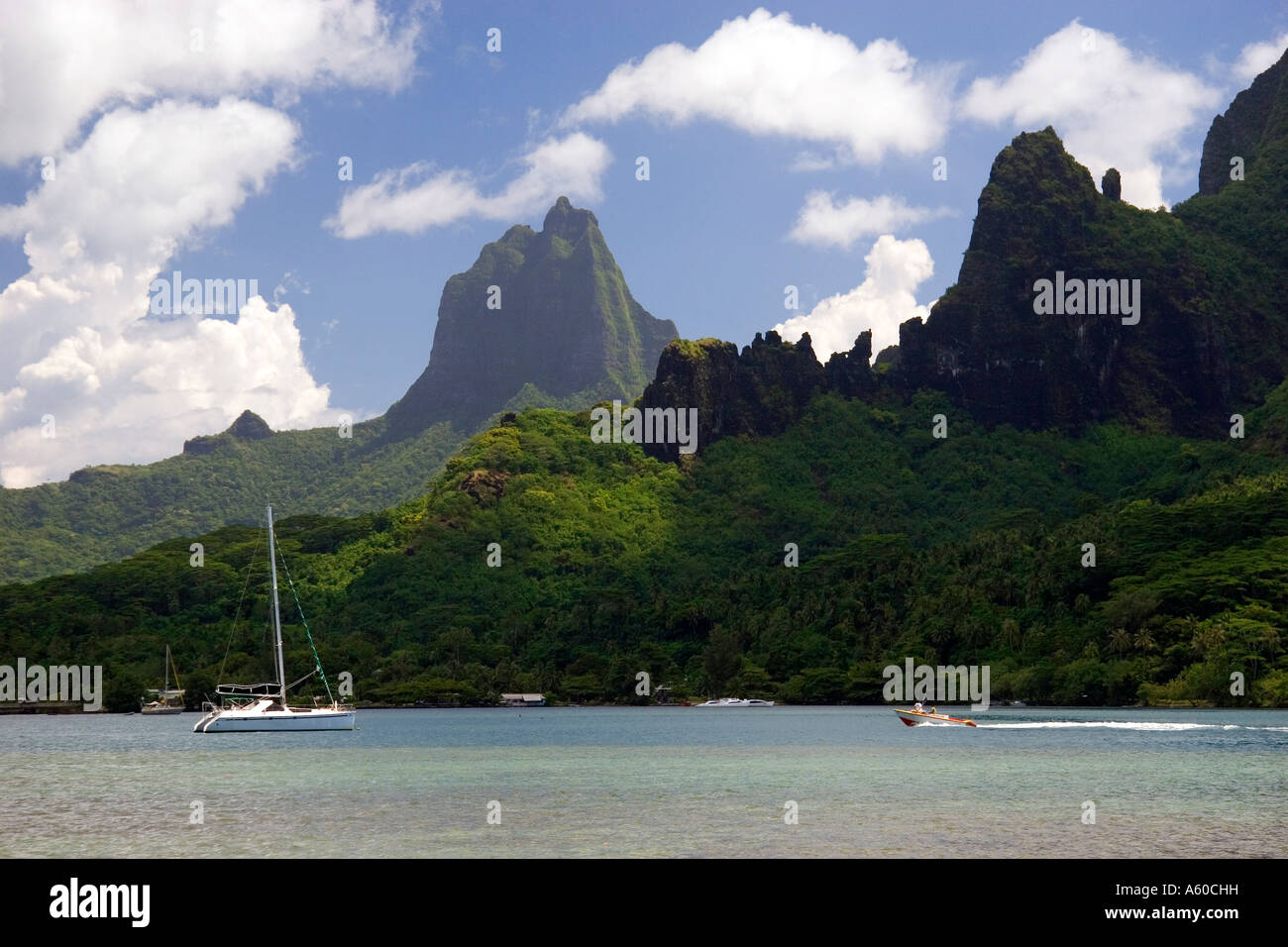 Boating in a lagoon on the island of Moorea at Cooks Bay Stock Photo