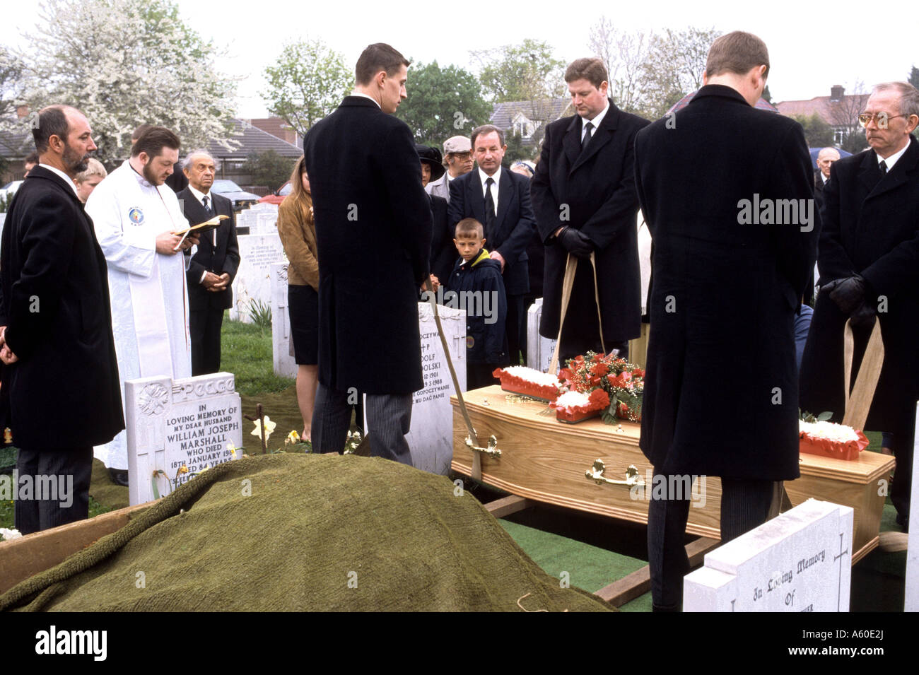 Burial scene in church cemetery Stock Photo