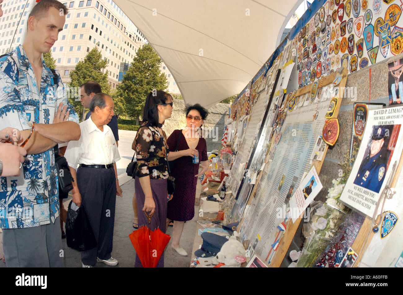 NEW YORK, NY, USA, Tourists Looking at Homemade Monument for 9/11 memorial art near 'ground Zero' 'Battery Park City''September 11' Stock Photo