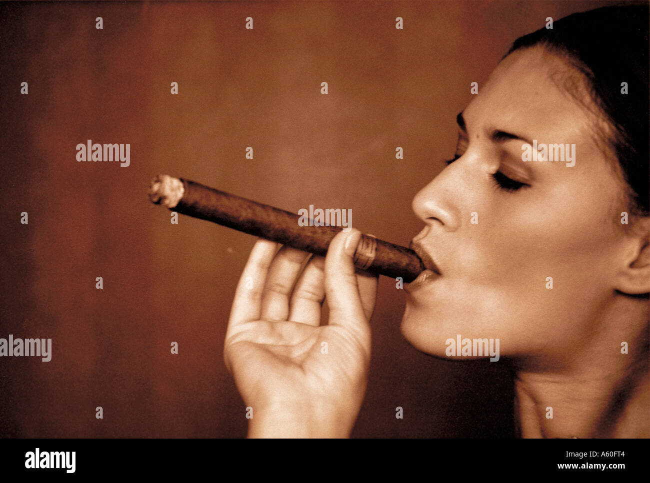 Woman smoking cigar side view Stock Photo Alamy