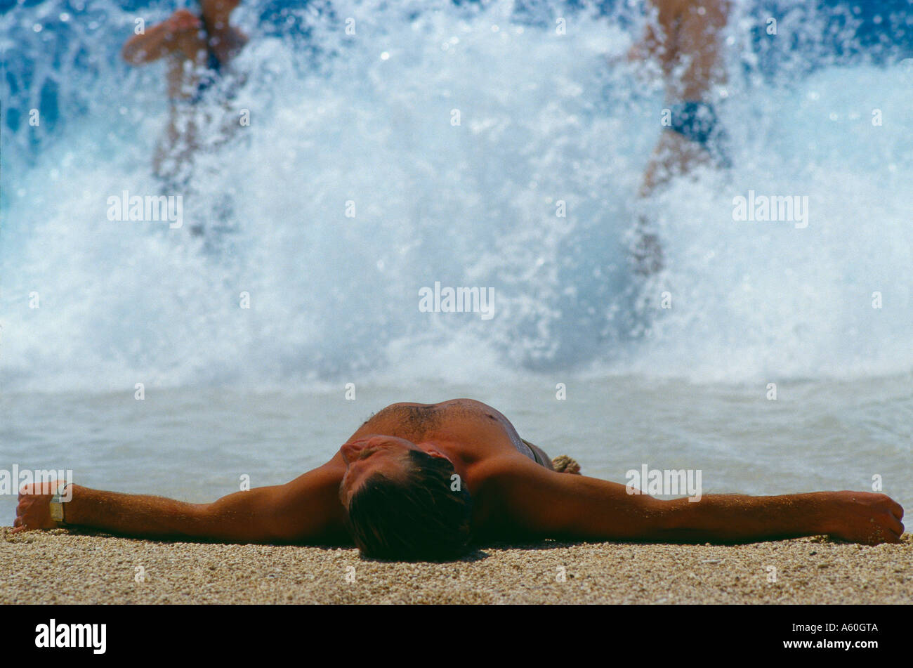 sunbather on Kaputas beach south coast nr Kas Turkey Stock Photo