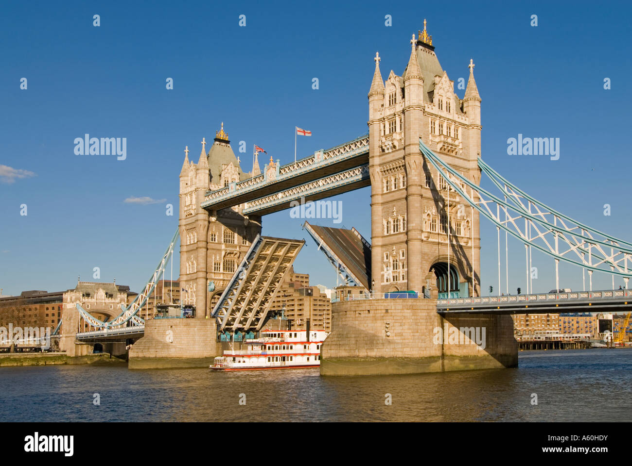 Horizontal wide angle of Tower Bridge being raised to allow a paddle ...