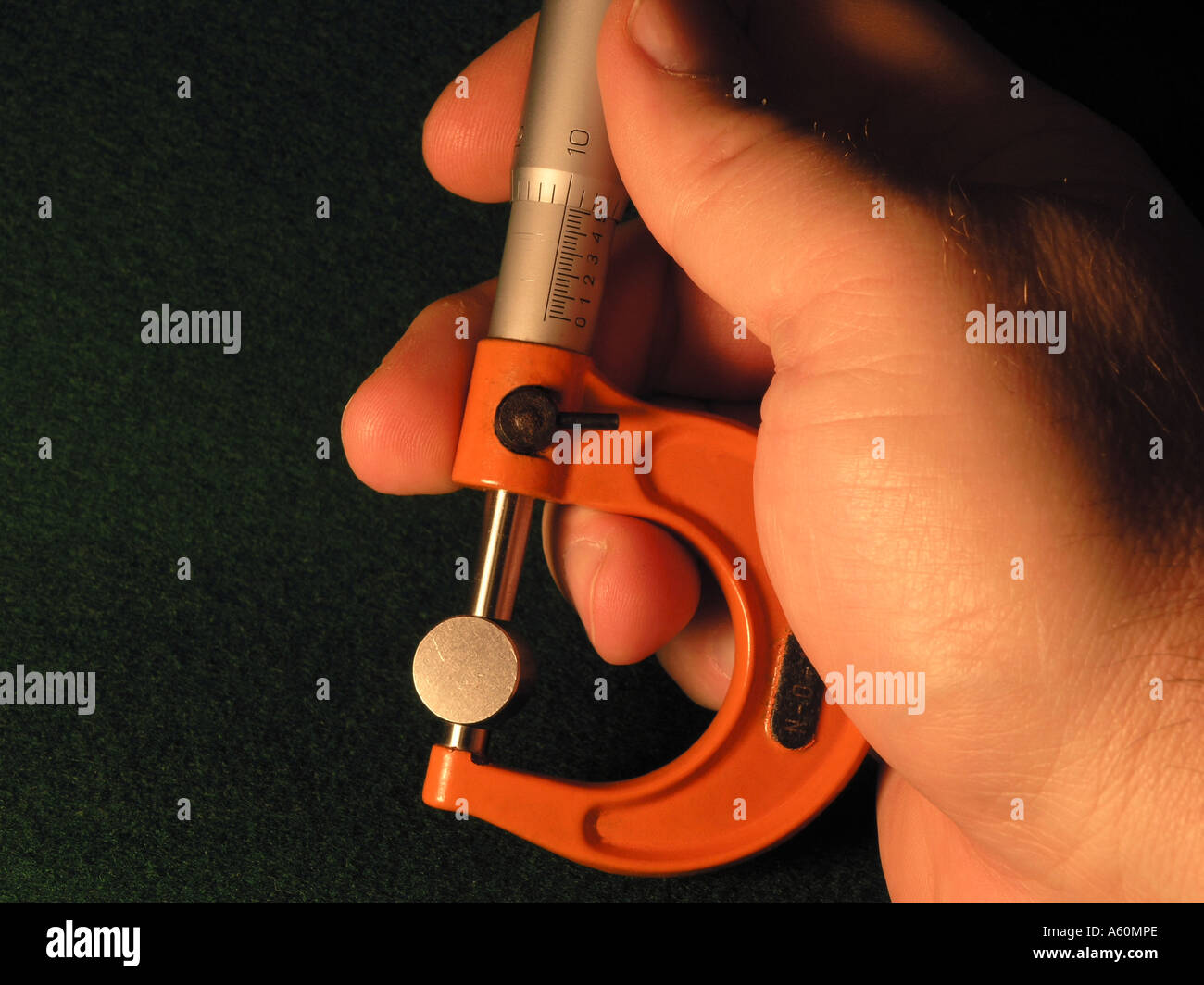 Micrometer in Use (English units) Icon of Precision and Quality Stock Photo