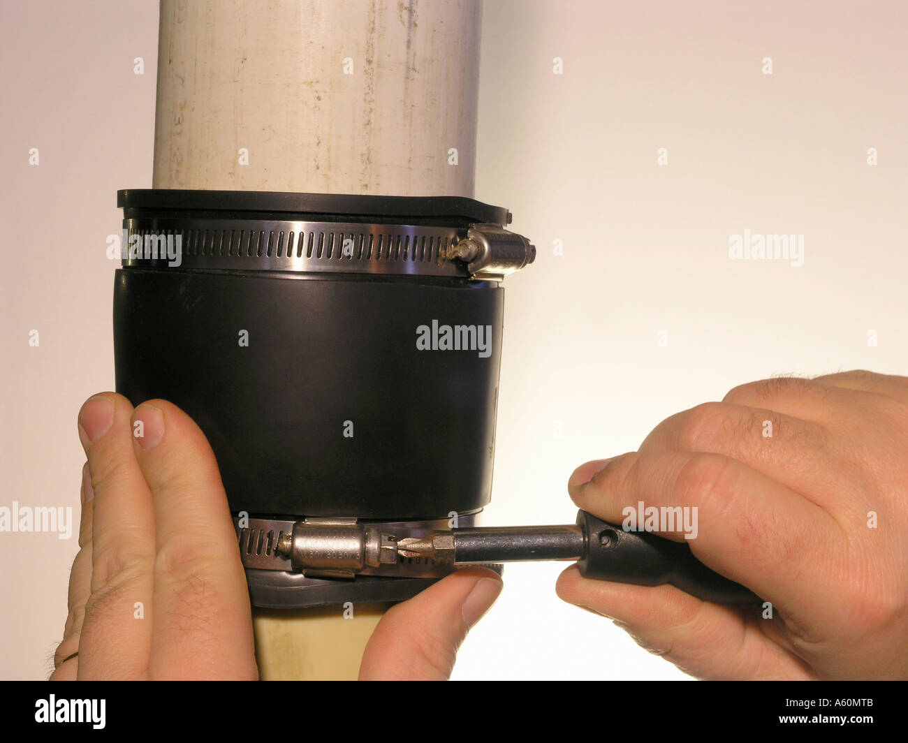 Plumber Installing Boot to Repair Pipe Stock Photo Alamy