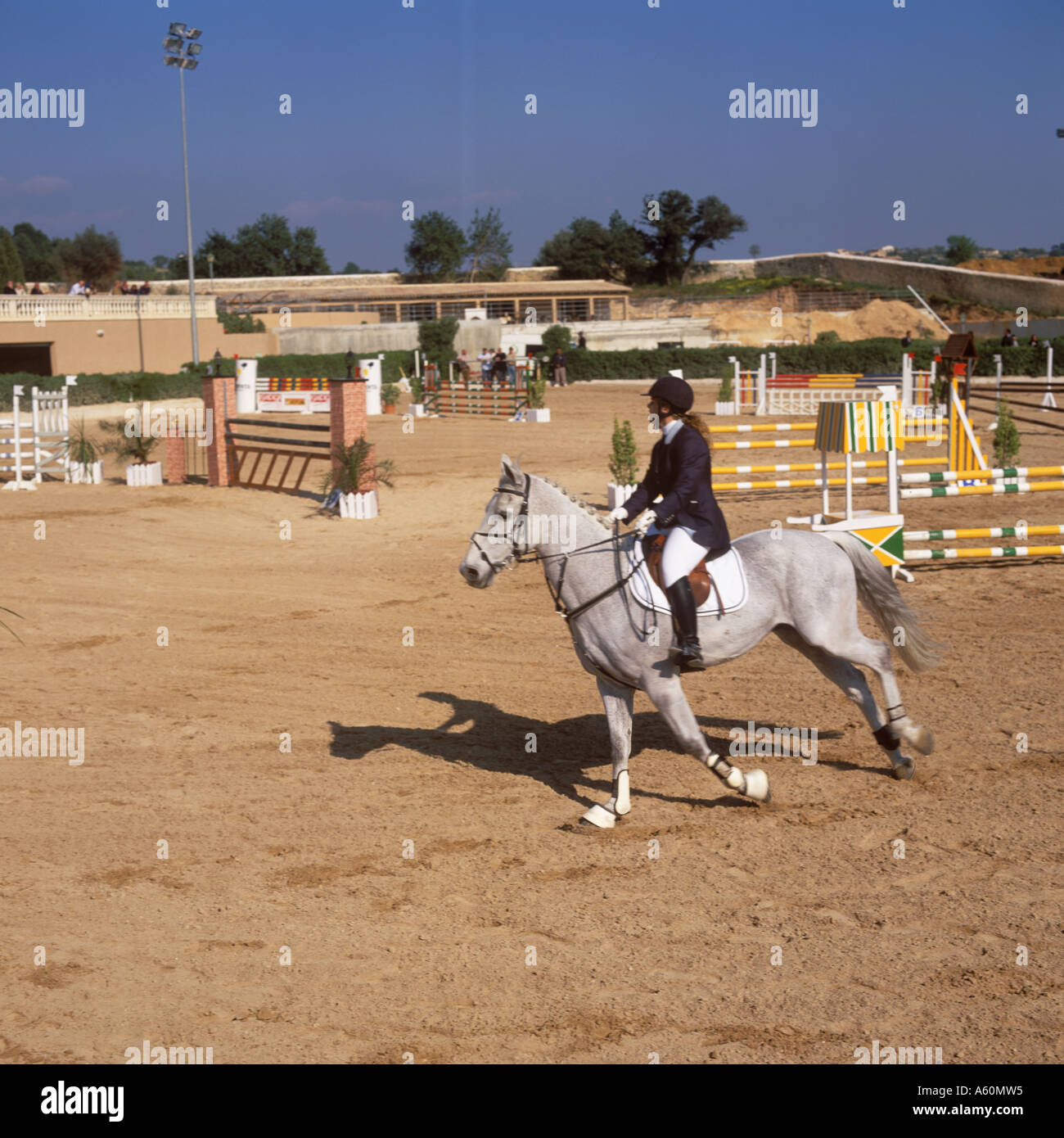 Horse and rider participating in a jumping competition at the Son Gual riding stables, near Palma de Mallorca, Baleares, Spain. Stock Photo