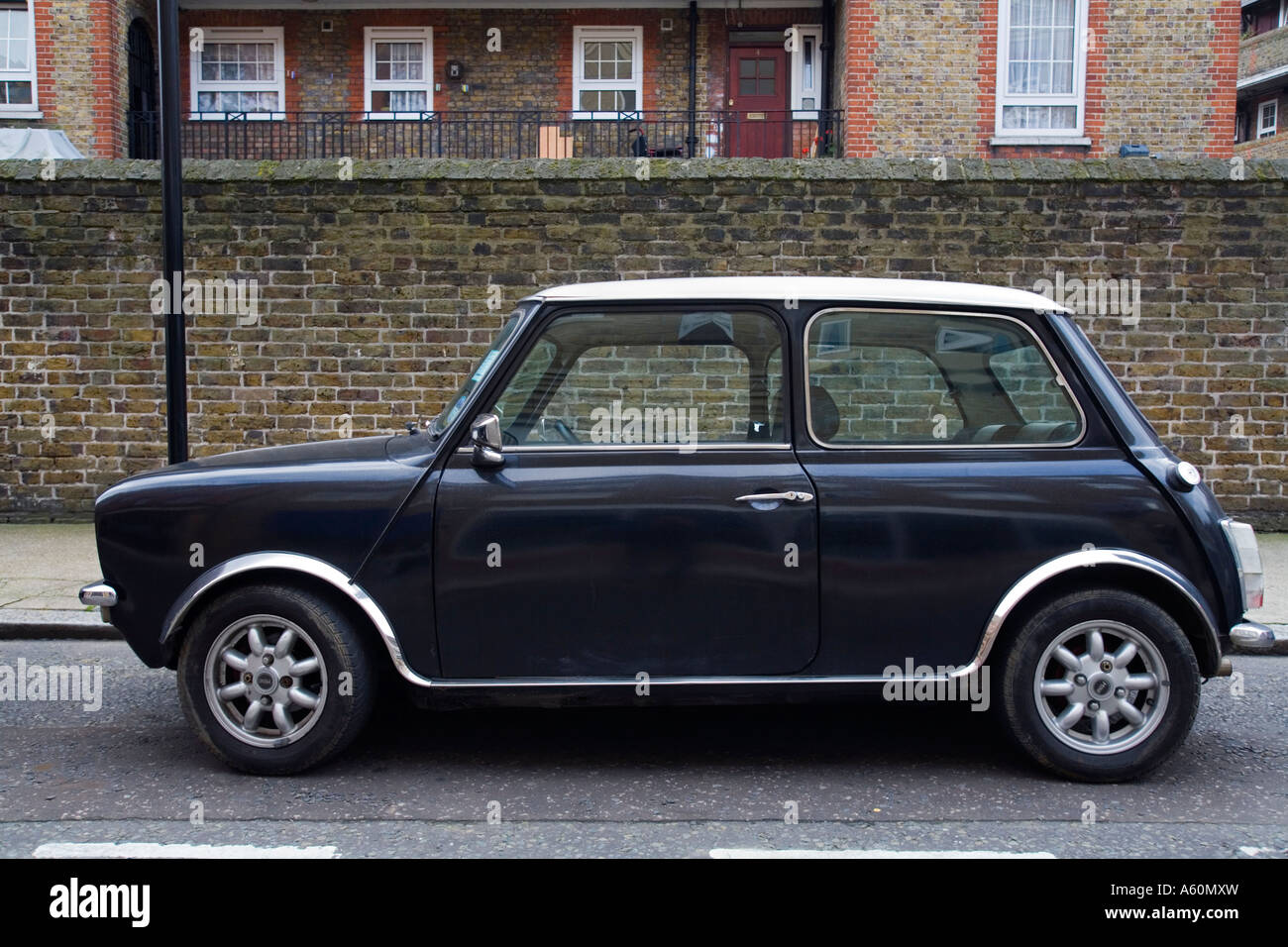 MINI Cooper parked in front of housing estate in London. Stock Photo