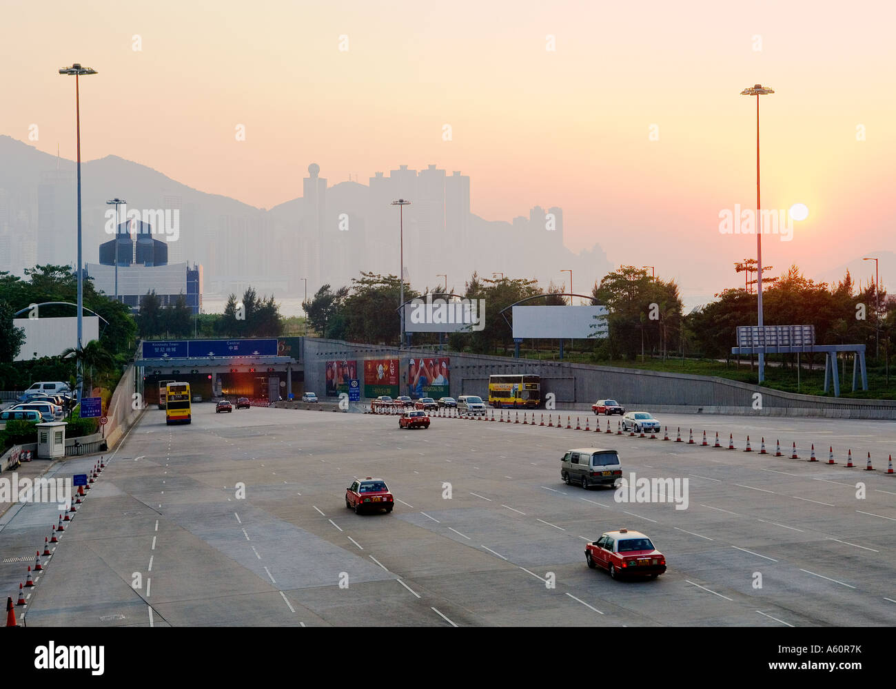 Northern Kowloon entrance of Western Harbour Crossing road tunnel. Hong Kong Island in distance beyond Victoria Harbour. China Stock Photo