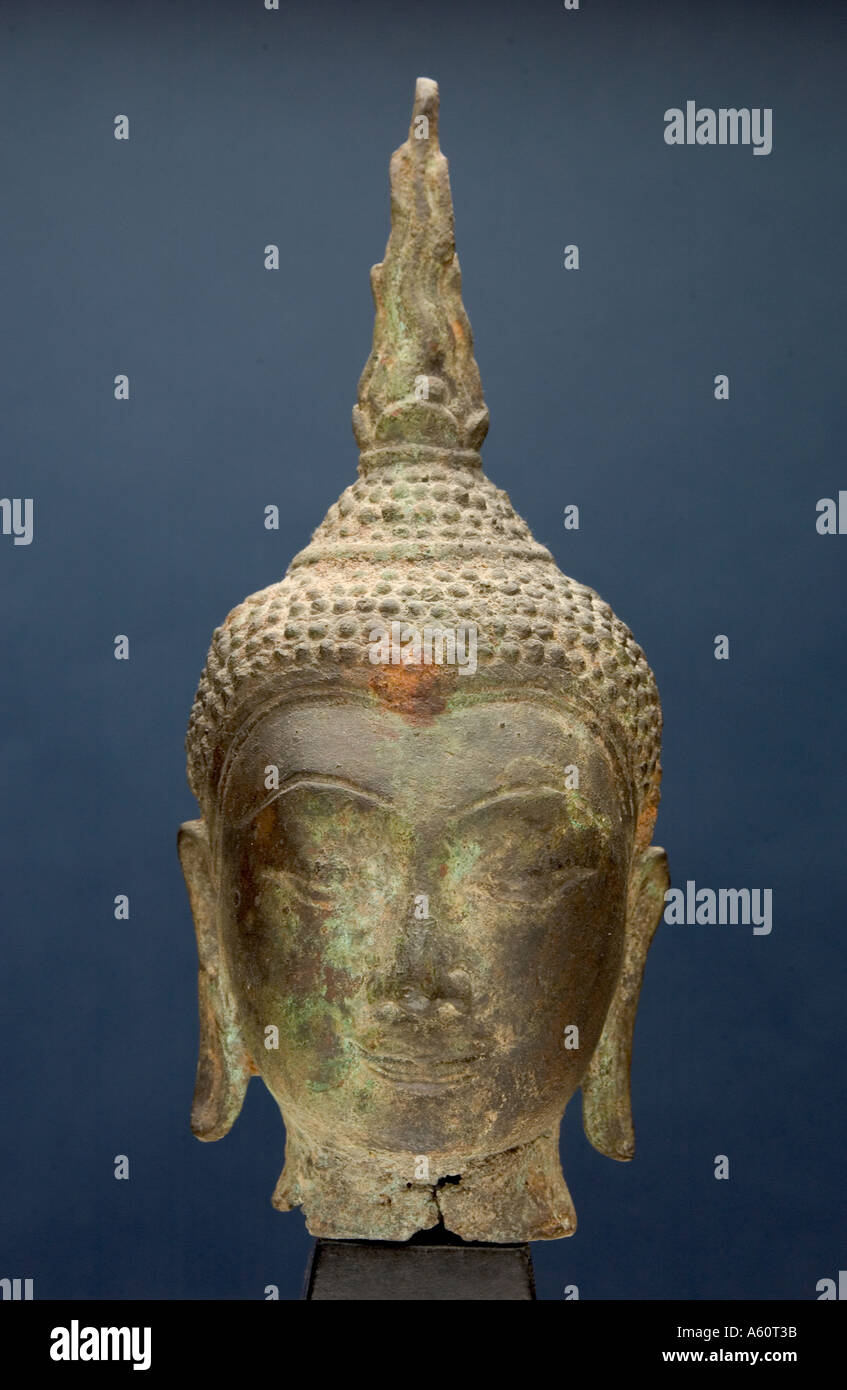 Cast iron Buddha head on Platform Stock Photo - Alamy