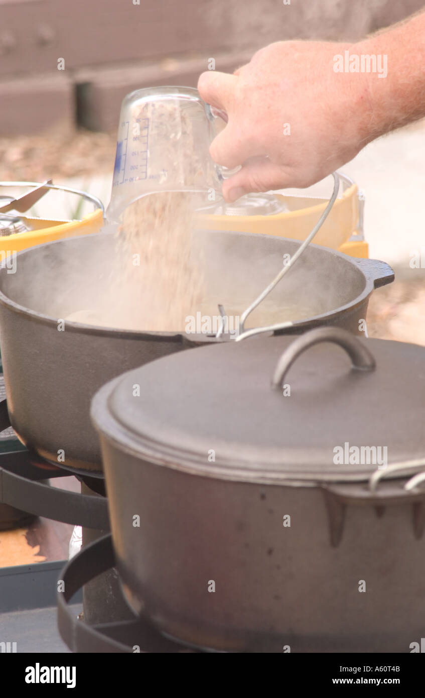 https://c8.alamy.com/comp/A60T4B/chef-pouring-ingredients-into-big-soup-pot-A60T4B.jpg