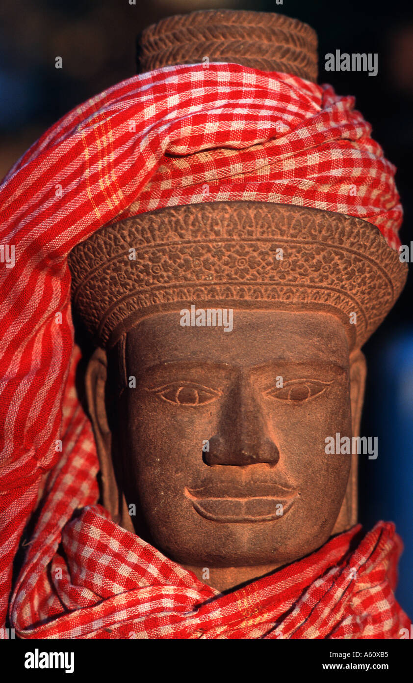 Stone sculpture Khymer style Angkor Cambodia The krama a checked cotton scarf found in local markets across the country Stock Photo